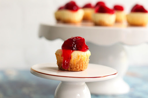 Bite-Size New York Style Cheesecake with fruit topping.