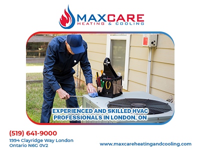 A technician checking on an HVAC unit.