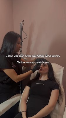 Clean, professional medical spa treatment room with neutral tones at Numi Aesthetics Pllc in Windham
