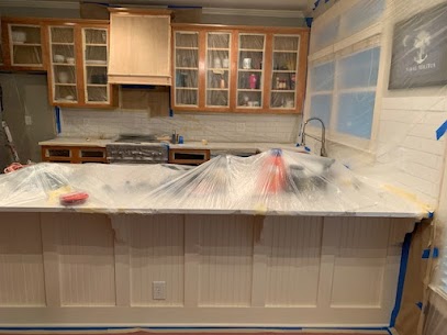 protect everything in your kitchen with plastic and tape before cabinet refinishing in roswell