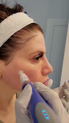 Clean, professional medical spa treatment room with neutral tones at Posh Aesthetics in Frederick