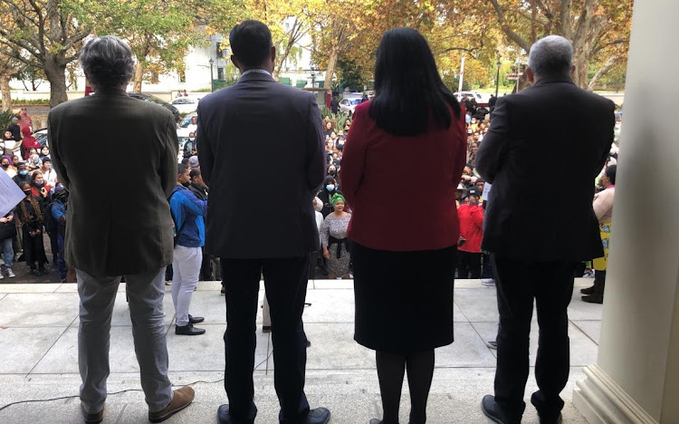 Marchers are greeted at the Stellenbosch University administration building on May 19 2022 by, from left, vice-chancellor and rector Wim de Villiers and deputy vice-chancellors Deresh Ramjugernath, Hester Klopper and Nico Koopman.