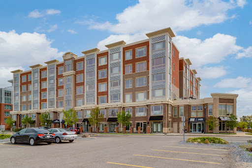 Modern building facade with parking lot in this luxury apartment / penthouse for sale in Calgary ($224,385)
