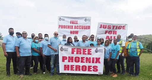 African Democratic Change president Visvin Reddy with supporters during a campaign call for several people arrested for killings during unrest and looting in July to be released on bail.