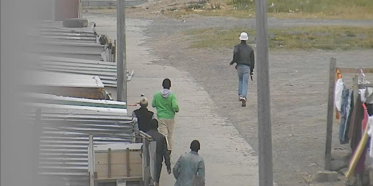 Virgil Koopman captured on CCTV brandishing a pistol in Manenberg.