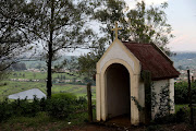 A tombstone for Father Albert Hanon at the entrance to the St Theresa Catholic Mission overlooking the dam he made for the community of Inchanga. 