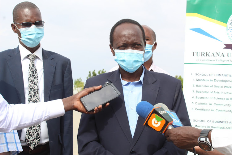 The new principal of Turkana University College Prof George Chemining’wa addresses the press at the institution on August 4.