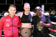 SA junior welterweight female boxing champion Hedda Wolmarans and her trainers Colin Nathan and Vusi Mtolo.