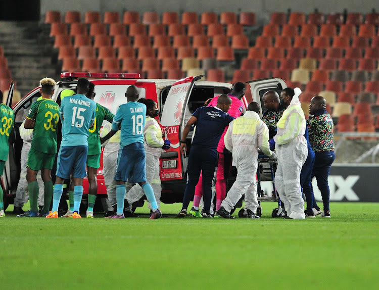 Orlando Pirates left-back Paseka Mako leaves the pitch by ambulance after being injured in the DStv Premiership match against Baroka FC at Peter Mokaba Stadium in Polokwane on April 12 2022.