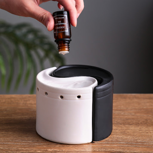 Title 1, Black and white ceramic aromatherapy stove. Dif...