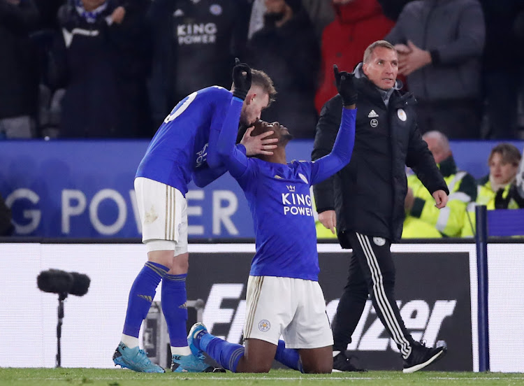 Leicester City's Kelechi Iheanacho celebrates with James Maddison as manager Brendan Rodgers looks on