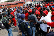 EFF supporters gather outside the Dobsonville police station in Soweto to support Victor Ramerafe who opened a case of assault, intimidation and house-breaking against Operation Dudula leader Nhlanhla Lux.  Photo Thulani Mbele