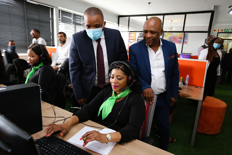 Acting mayor Tshonono Buyeye, left, telemarketer Nombulelo Fulumeni and Dastile Wealth Insure MD Vuyo Dastile at the official opening of the venture on Thursday