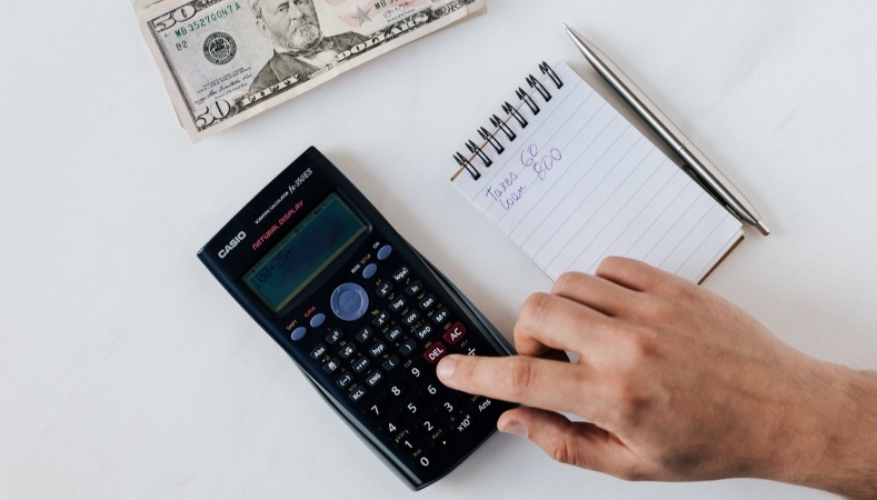 using a calculator to calculate finances before a move