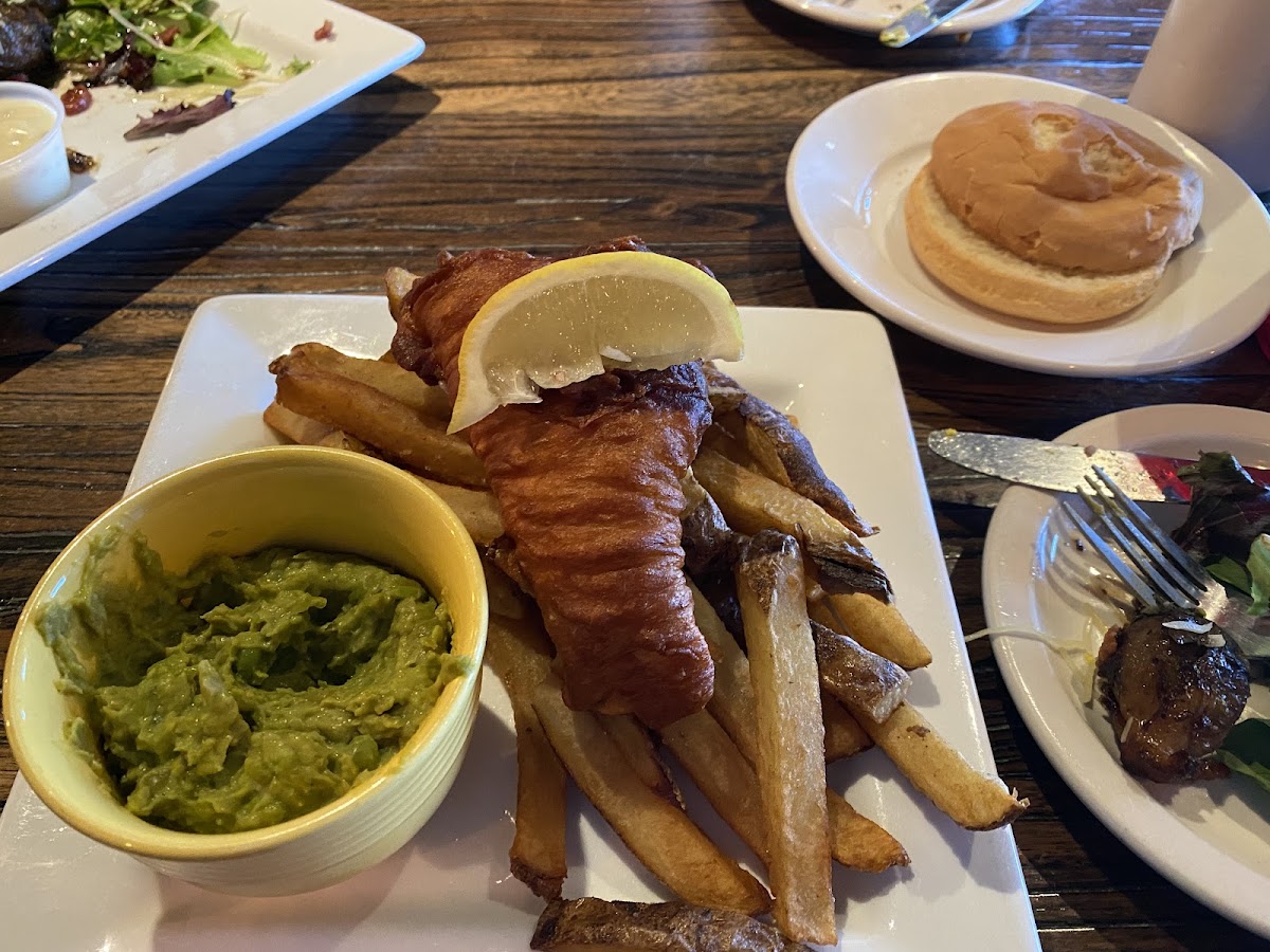 Lunch portion of fish and chips with Mushy Peas. Plus a bun.