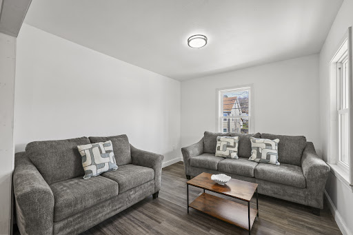 Living room with two grey sofas - Buy this luxury apartment / penthouse in Adams, 18 bedrooms