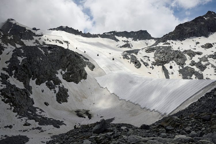 Large white geotextile sheets cover northern Italy's Presena glacier in order to delay snow melting on skiing slopes and reflect sunlight during summer months, at Passo del Tonale, near Trento, Italy, July 13, 2020.