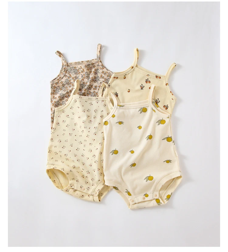 Title 2, Zomerse baby romper van katoen met print en dra...