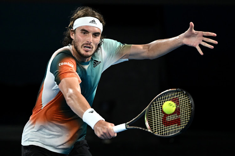 Stefanos Tsitsipas of Greece hits a backhand in his fourth round singles match Taylor Fritz of United States against during day eight of the Australian Open at Melbourne Park on January 24, 2022