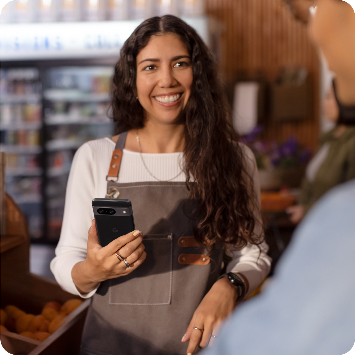 A woman working on a Google 8 Pro phone in her shop.