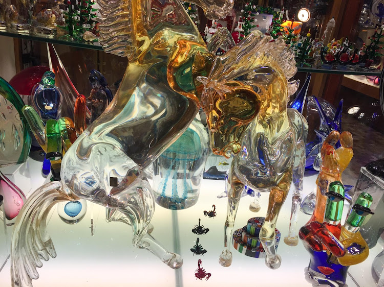 Horses made of glass in a shop window along the Procuratie Vecchie on Piazza San Marco, Venice. 