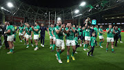 Ireland celebrate after their Grand Slam victory after their Six Nations match against England at Aviva Stadium in Dublin on March 18 2023.