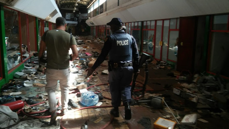 The trail of damage left during the looting that happened overnight at a mall next to Germiston railway station.