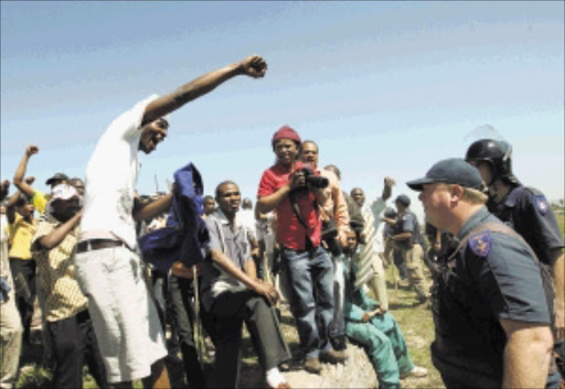 UP IN ARMS: Several people were arrested yesterday after a group of shack and backyard dwellers illegally occupied an open piece of land at Bloekombos in Kraaifontein. PHOTO: ESA ALEXANDER