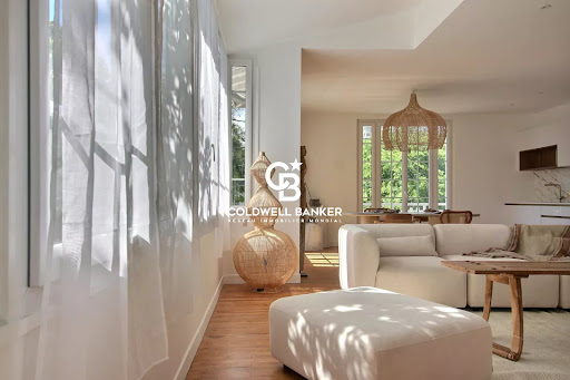 Modern living room with bright white sofa in this luxury house for sale in Arcachon ($1,730,526 - 160 m²)