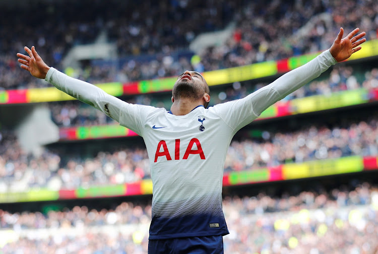 Lucas Moura celebrates after scoring against Huddersfield