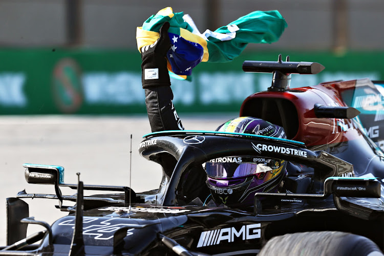 Race winner Lewis Hamilton GP celebrates as he arrives into parc ferme during the F1 Grand Prix of Brazil at Autodromo Jose Carlos Pace on November 14 2021 in Sao Paulo.