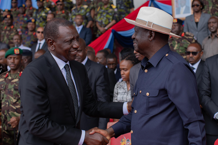 President William Ruto shakes hand with Opposition leader Raila Odinga during the memorial service of late General Francis Ogolla at Ulinzi sports complex on April 20, 2024.