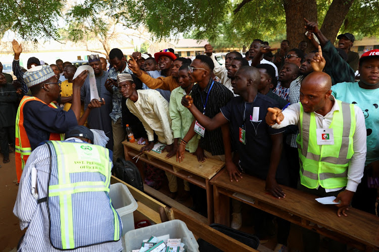 Party agents react during the counting of ballots, after voting ended, at a polling station, in Nigeria's presidential election, in Yola, Nigeria, February 25 2023. Picture: ESA ALEXANDER/REUTERS