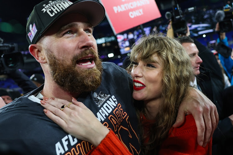 Travis Kelce of the Kansas City Chiefs celebrates with girlfriend Taylor Swift after defeating the Baltimore Ravens in the AFC Championship game at M&T Bank Stadium on in Baltimore, Maryland on January 28.