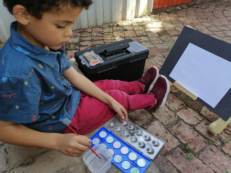 Mom blogger Eleanor Douglas-Meyers’ six-year-old son, Aidan, keeps himself busy with craft painting at home