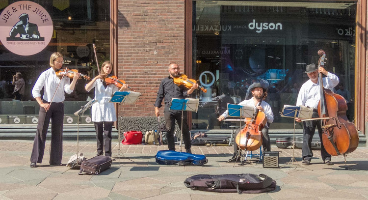 Street musicians in downtown Helsinki, Finland. 