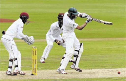 WELL TIMED: Hashim Amla of SA drives on day one of the first Test against West Indies in Centurion yesterday Photo: Duif du ToIt/ Gallo Images