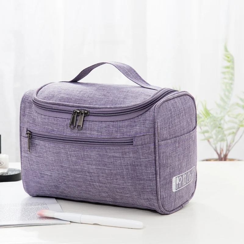 Draagbare make-up tas met haak, grote capaciteit, ideaal voor reizen en het organiseren van cosmetica en toiletartikelen onderweg.
