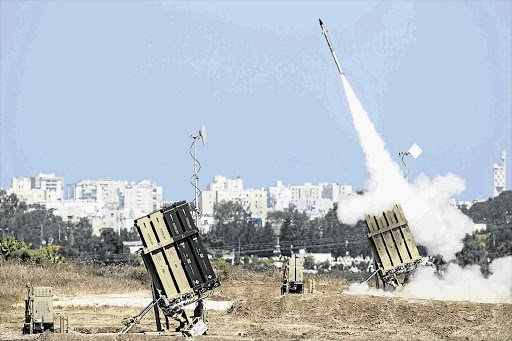 FIRE WITH FIRE: The Iron Dome air-defence system fires to intercept a rocket over the southern Israeli city of Ashdod. More then 130 rockets were reportedly fired from Gaza in the past three weeks