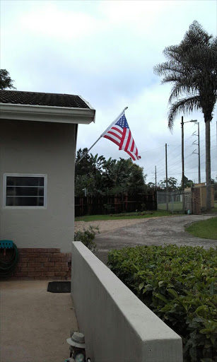 The US flag which sparked outrage hanging outside Crouch's home Picture: SUPPLIED