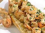 Shrimp Scampi Po-Boy on Garlic Bread was pinched from <a href="http://www.foodnetwork.com/recipes/emeril-lagasse/shrimp-scampi-po-boy-on-garlic-bread-recipe/index.html" target="_blank">www.foodnetwork.com.</a>