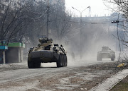 Armoured vehicles of pro-Russian troops drive along a street during the Ukraine-Russia conflict in the besieged city of Mariupol, Ukraine, on March 31 2022. 