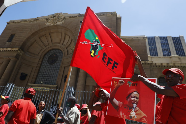 EFF supporters sing outside the Johannesburg high court during the party's legal battle with AfriForum over the 'kill the boer' song. Photo Thulani Mbele