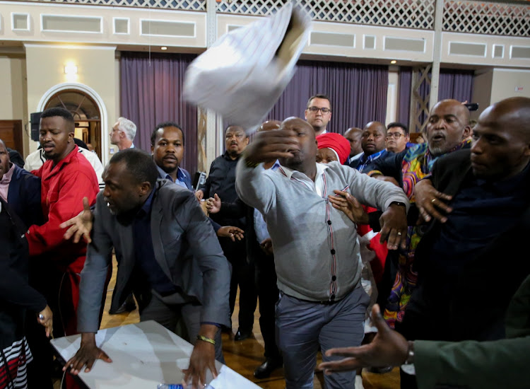 Councillors fight over a ballot box at the Nelson Mandela Bay council meeting on Wednesday