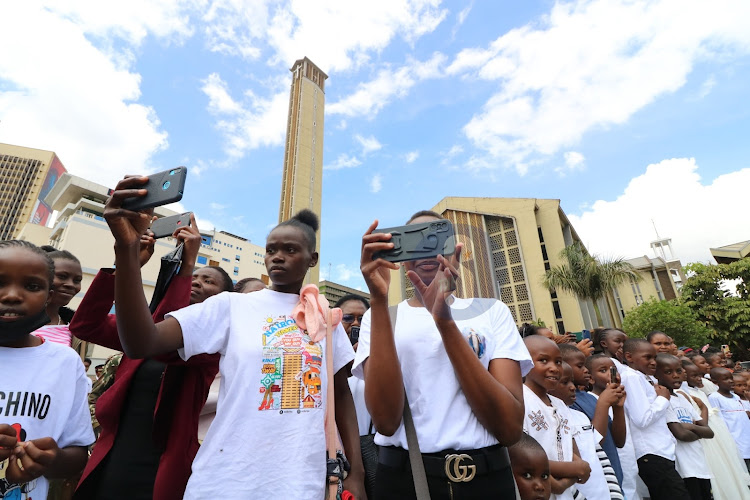 Some catholic faithful attending the mass enjoy the parade by different Disciplined security services on November 6, 2022