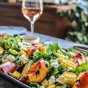 Summer food and wine pairing for Muscat, rosé, or extra-dry sparkling wine: Grilled Nectarine Salad with Arugula, Prosciutto, and Corn
