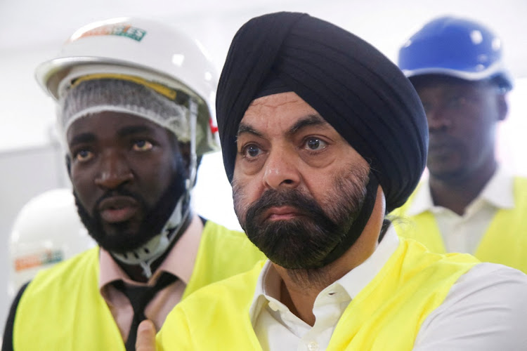 US nominee to head World Bank, Ajay Banga, stands with officials during his visit at the headquarters of Ivorian electricity company of Yopougon in Abidjan, Ivory Coast, March 7 2023. Picture: LUC GNAGO/REUTERS