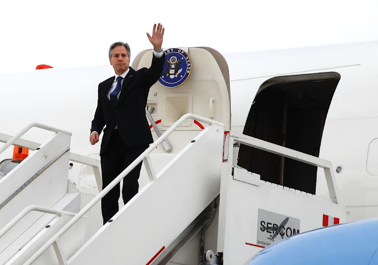 US Secretary of State Antony Blinken waves from the plane as he departs at Felipe Angeles International Airport in Zumpango, Mexico, on December 27 2023.