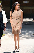 The Duchess of Sussex in a trench dress by Banana Republic.