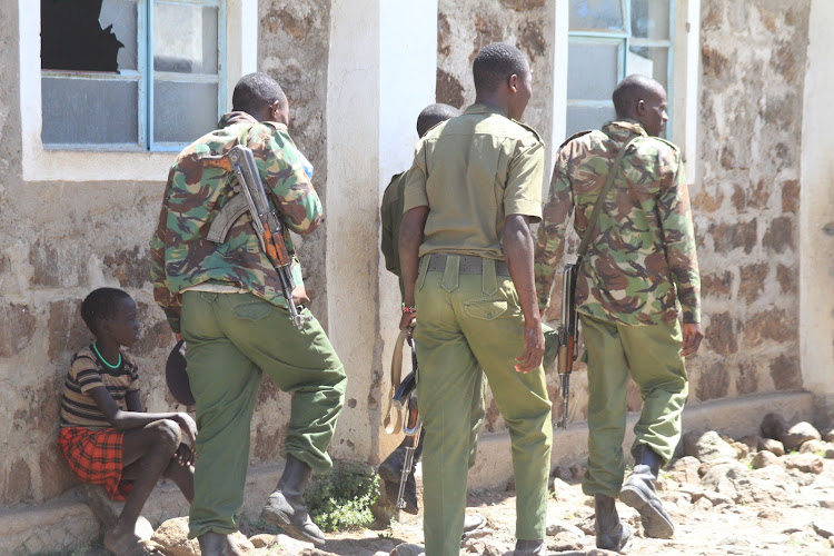 Police officers on security patrol at Riongo near the volatile Kapedo border of Baringo and Turkana counties on August 27